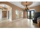 Living room with high ceilings, a chandelier, and marble floors at 17557 Ohara Dr, Port Charlotte, FL 33948