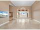 Living room with high ceilings, a view of the pool, and marble floors at 17557 Ohara Dr, Port Charlotte, FL 33948