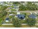 Aerial view showcasing a house with solar panels and a spacious backyard at 1763 Oakland Rd, North Port, FL 34286