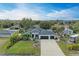 Aerial view of a single-Gathering home with a large yard at 1763 Oakland Rd, North Port, FL 34286