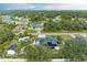 Aerial view of a house with solar panels, RV, shed, and lush landscaping at 1763 Oakland Rd, North Port, FL 34286