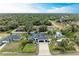 Aerial view of a house with a large yard and detached garage at 1763 Oakland Rd, North Port, FL 34286