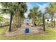 Backyard patio area with gravel and tropical landscaping at 1763 Oakland Rd, North Port, FL 34286