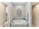 Bathroom with soaking tub and walk-in shower at 1763 Oakland Rd, North Port, FL 34286