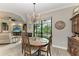 Charming dining room with wooden table and chandelier at 1763 Oakland Rd, North Port, FL 34286