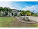 Modern, single-story home with attractive landscaping and a three-car garage at 1763 Oakland Rd, North Port, FL 34286