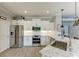 Stainless steel appliances and white shaker cabinets in kitchen at 1763 Oakland Rd, North Port, FL 34286