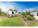 Large RV parked on a grassy area with landscaping at 1763 Oakland Rd, North Port, FL 34286