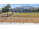 View of the home's backyard, featuring a pool and patio at 18500 Ohara Dr, Port Charlotte, FL 33948