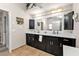 Modern bathroom with double vanity and dark brown cabinets at 18500 Ohara Dr, Port Charlotte, FL 33948