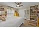 Bedroom with queen-size bed, dresser, and built-in shelves at 18500 Ohara Dr, Port Charlotte, FL 33948