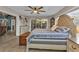 Main bedroom with king-size bed and access to patio at 18500 Ohara Dr, Port Charlotte, FL 33948