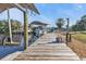 Wooden dock with boat lift and canal access at 18500 Ohara Dr, Port Charlotte, FL 33948