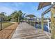 Long wooden dock leading to the water at 18500 Ohara Dr, Port Charlotte, FL 33948