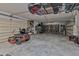 Spacious garage with overhead storage and work bench at 18500 Ohara Dr, Port Charlotte, FL 33948