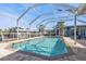 Sparkling pool with screened enclosure, offering privacy at 18500 Ohara Dr, Port Charlotte, FL 33948