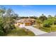 Single-Gathering house with solar panels and lush landscaping at 201 Champion St, Port Charlotte, FL 33953