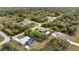 Aerial view of a home on a spacious lot, surrounded by lush greenery at 201 Champion St, Port Charlotte, FL 33953