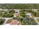 Aerial view of a single-Gathering home on a large lot with mature trees at 201 Champion St, Port Charlotte, FL 33953