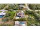 Aerial view of home with pool and solar panels; large lot in quiet neighborhood at 201 Champion St, Port Charlotte, FL 33953