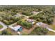 Aerial view of a house with a pool, located in a residential area at 201 Champion St, Port Charlotte, FL 33953