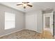 Bedroom with double door closet and wood-look tile floor at 201 Champion St, Port Charlotte, FL 33953