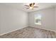 Bedroom with wood-look tile floor and window at 201 Champion St, Port Charlotte, FL 33953