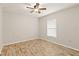 Bedroom with wood-look tile floor and window at 201 Champion St, Port Charlotte, FL 33953