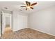 Bedroom with double door closet and wood-look tile floor at 201 Champion St, Port Charlotte, FL 33953