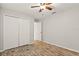 Bright bedroom with wood-look floors and double door closet at 201 Champion St, Port Charlotte, FL 33953