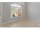 Dining room with large window and tile flooring at 201 Champion St, Port Charlotte, FL 33953