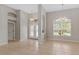 Bright dining room with tile floors and view of entryway at 201 Champion St, Port Charlotte, FL 33953