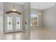 Bright entryway with double doors and tile floor at 201 Champion St, Port Charlotte, FL 33953