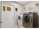 Laundry room with washer, dryer and storage at 201 Champion St, Port Charlotte, FL 33953