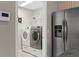 Laundry room with washer, dryer, and shelving at 201 Champion St, Port Charlotte, FL 33953