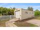 Well-maintained storage shed with a spacious garage door at 201 Champion St, Port Charlotte, FL 33953