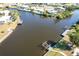 Wide shot of canal and surrounding properties from above at 21094 Edgewater Dr, Port Charlotte, FL 33952