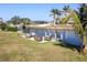 Relaxing patio furniture overlooking canal with private dock at 21094 Edgewater Dr, Port Charlotte, FL 33952