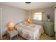 Cozy bedroom with double bed, nightstand, and dresser at 21094 Edgewater Dr, Port Charlotte, FL 33952