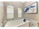 Relaxing bathroom with a soaking tub and marble accents at 21391 Harborside Blvd, Port Charlotte, FL 33952