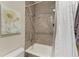 Bathroom with shower/tub combo and updated tile at 21391 Harborside Blvd, Port Charlotte, FL 33952