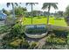 Gated community entrance with manicured landscaping and signage at 21391 Harborside Blvd, Port Charlotte, FL 33952