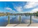 Tranquil waterfront dock with views of boats and homes at 21391 Harborside Blvd, Port Charlotte, FL 33952