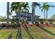 Two-story home with manicured landscaping and palm trees at 21391 Harborside Blvd, Port Charlotte, FL 33952