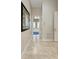 Elegant hallway with tile flooring leading to a luxurious bathroom at 21391 Harborside Blvd, Port Charlotte, FL 33952