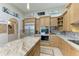 Modern kitchen with stainless steel appliances and a large island at 21391 Harborside Blvd, Port Charlotte, FL 33952