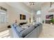 Bright living room featuring high ceilings, a large sectional sofa, and ample natural light at 21391 Harborside Blvd, Port Charlotte, FL 33952