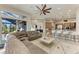 Open-plan living area with sectional sofa, views of pool and kitchen at 21391 Harborside Blvd, Port Charlotte, FL 33952