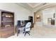 Home office with built-in shelving and a large work desk at 21391 Harborside Blvd, Port Charlotte, FL 33952