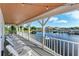 Relaxing waterfront porch with comfortable seating and water views at 21391 Harborside Blvd, Port Charlotte, FL 33952